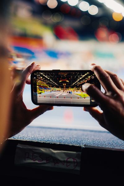 A person capturing photos using a smartphone on 19.03.2026 at the World Athletics Indoor Championships 2026 in Torun